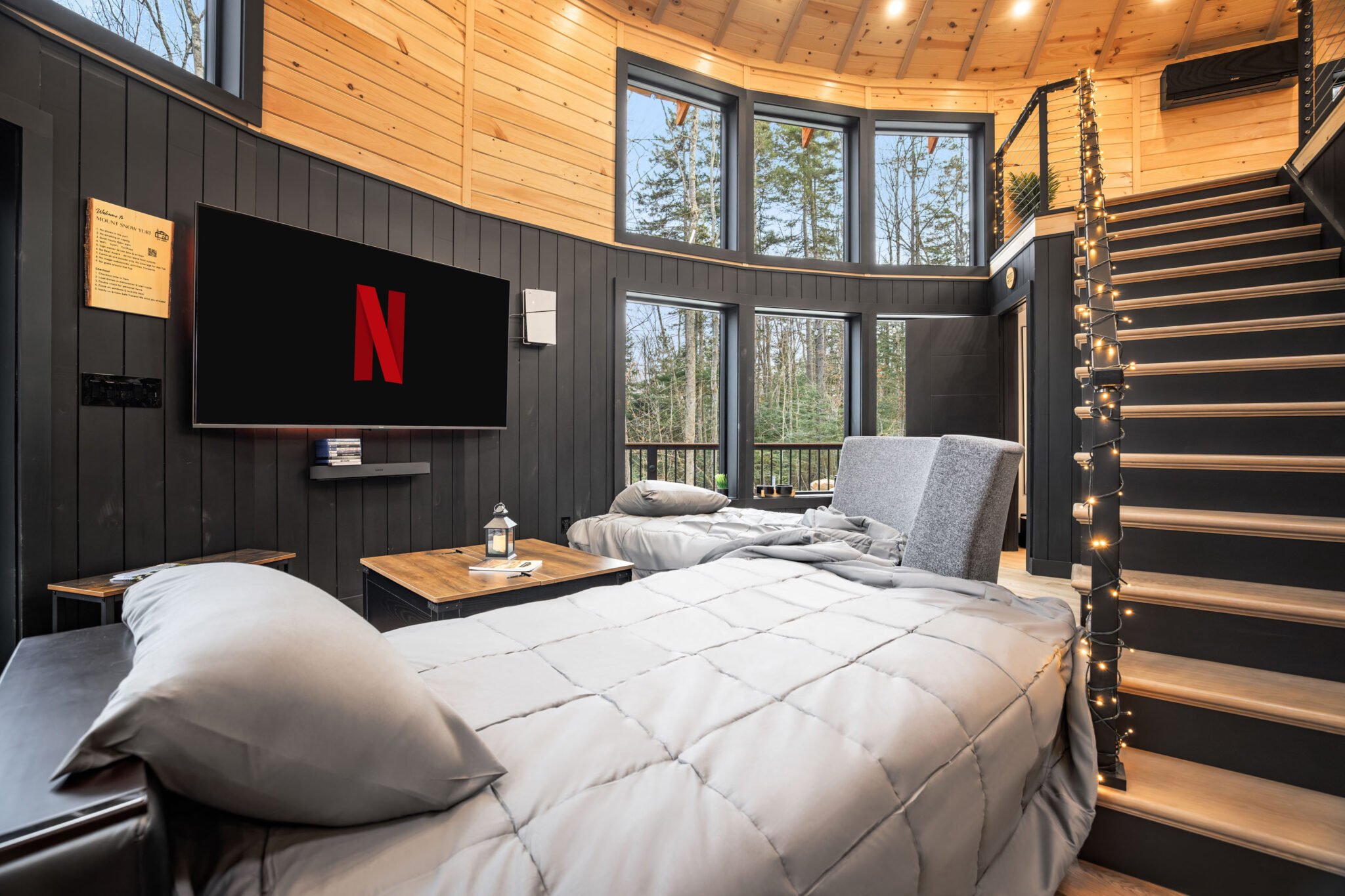 Living room sofa transformed into 2 semi-separate beds, 75 inch TV, PS5 with 4 controllers, forest views - Mount Snow Yurt